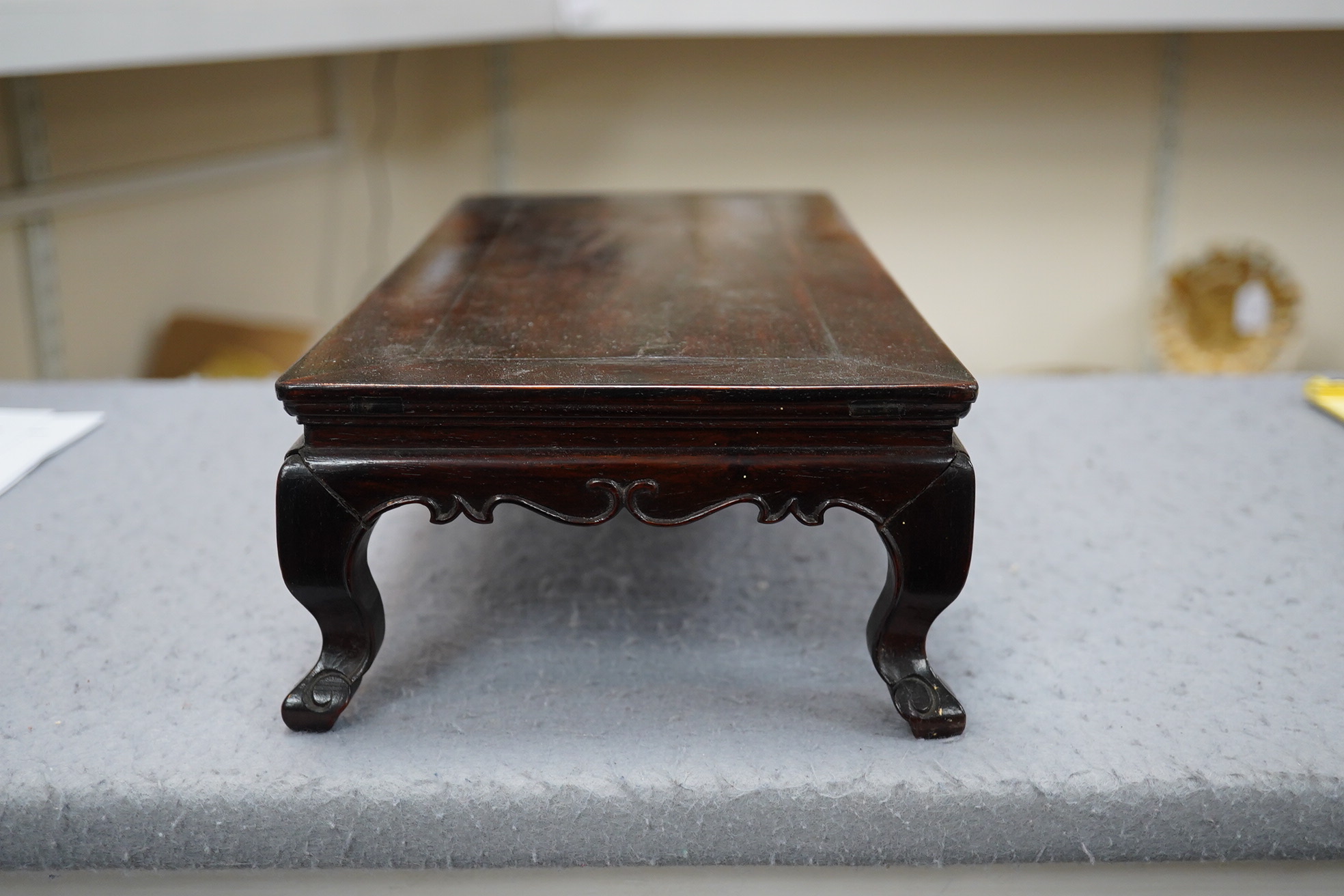 A Chinese huanghuali scholar’s stand, 18th/19th century, and a small reticulated zitan stand, 19th century